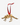Gold-tone stegosaurus skeleton ornament hanging from a red ribbon